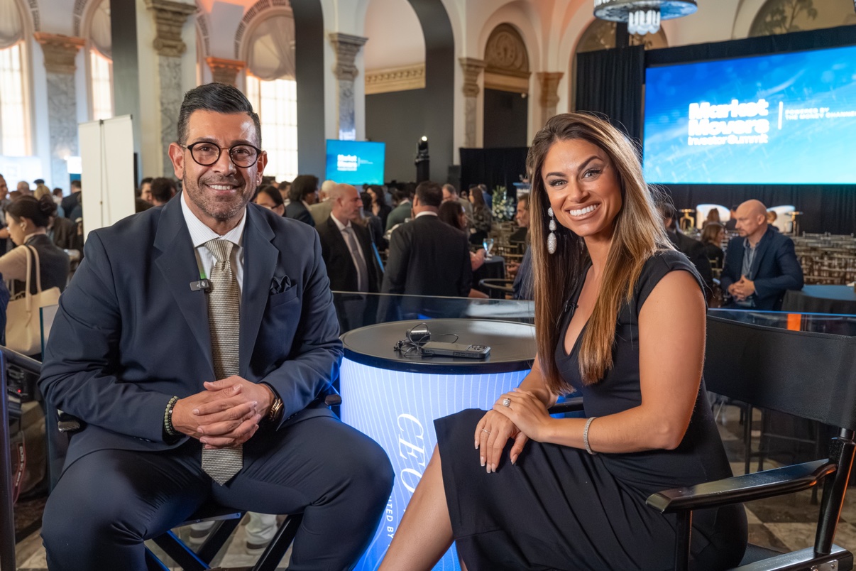 Richie Hosein on stage at Market Movers, announcing FreeHealth.ai's partnership with Sichenzia Ross on the road from seed to IPO